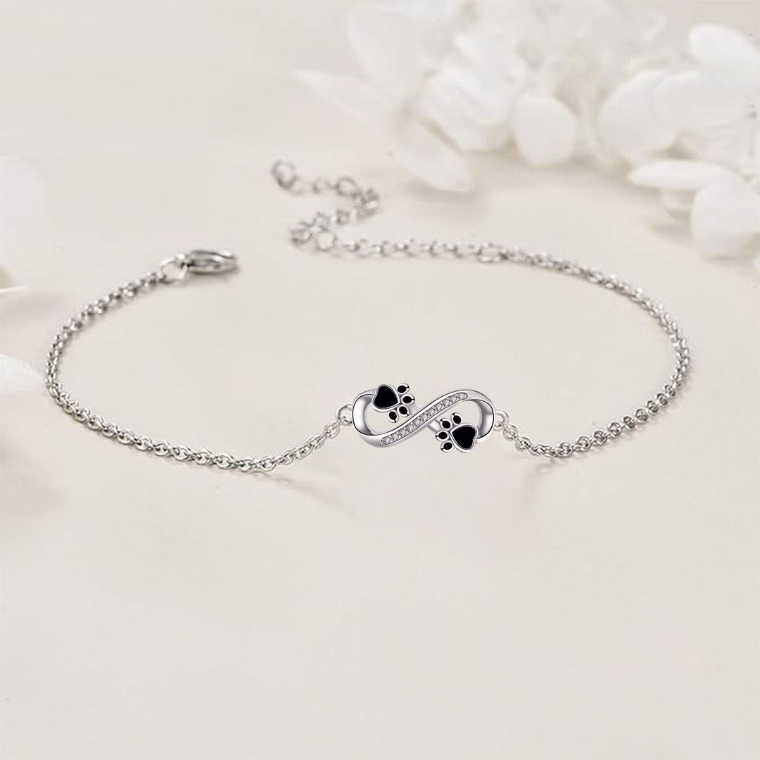 Bracelet avec symbole infini et breloque patte avec zircone
