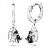 Boucles d'oreilles étreinte de chien