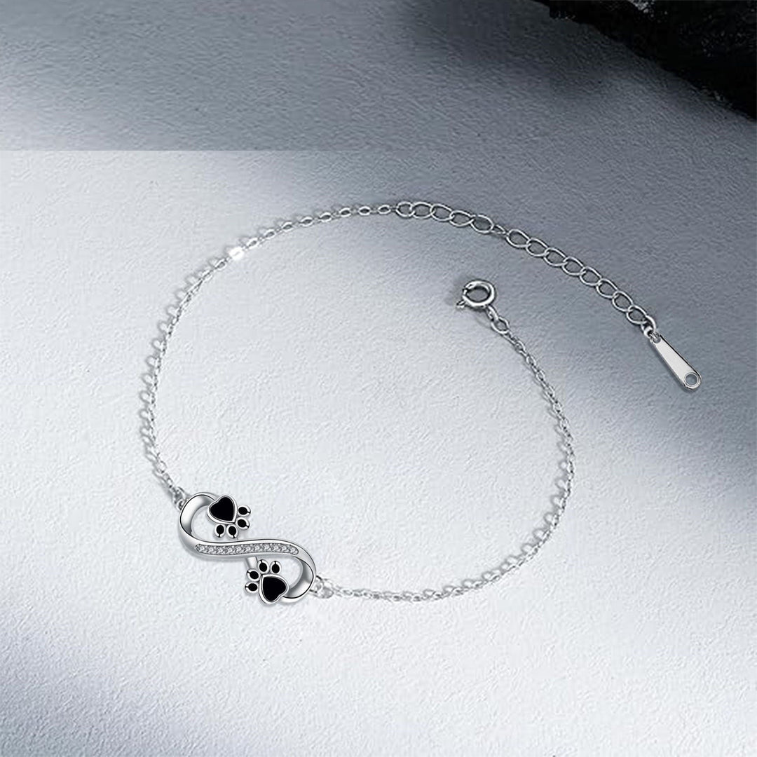 Bracelet avec symbole infini et breloque patte avec zircone