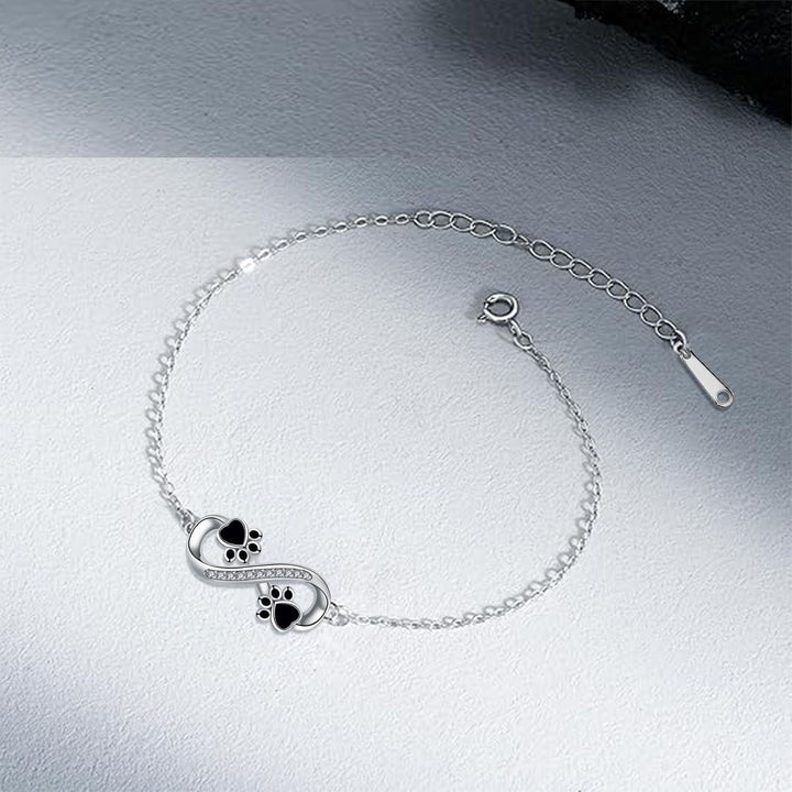 Bracelet avec symbole infini et breloque patte avec zircone