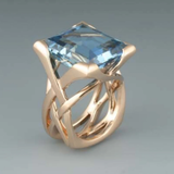 Bague vintage en or rose avec zircon bleu